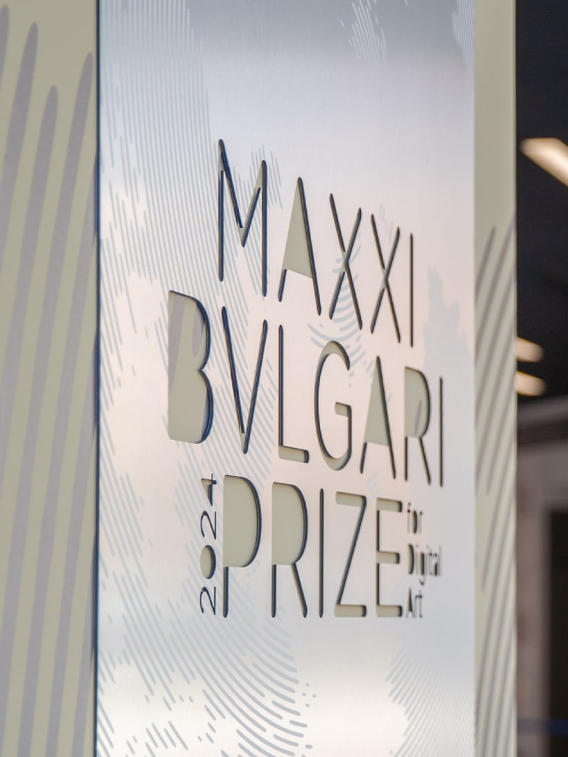 Exhibition room at MAXXI featuring a plaque with the MAXXI Bvlgari Prize inscription at the entrance.