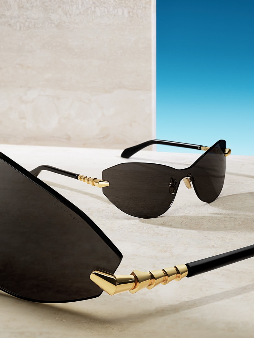 Serpenti Viper wrap-around sunglasses shown twice against a sky backdrop.