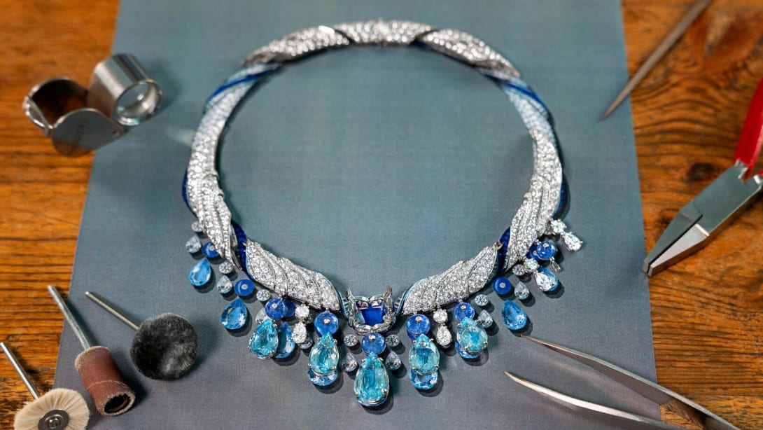 High Jewelry necklace being compared to the original sketch