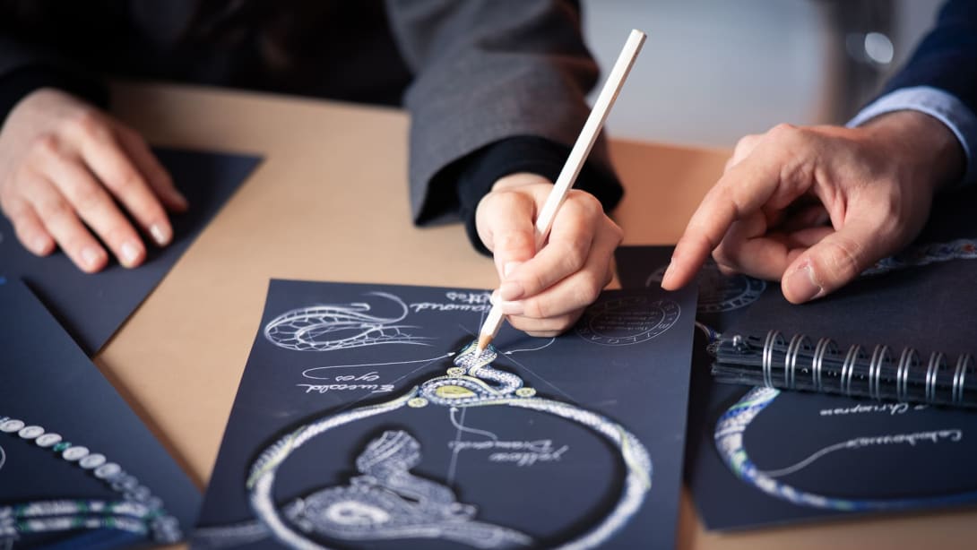 Close up on a designer's hand while drawing