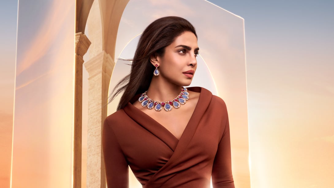 Priyanka Chopra Jonas wearing Bvlgari High Jewellery, dawn sky and Roman architecture in the background.  