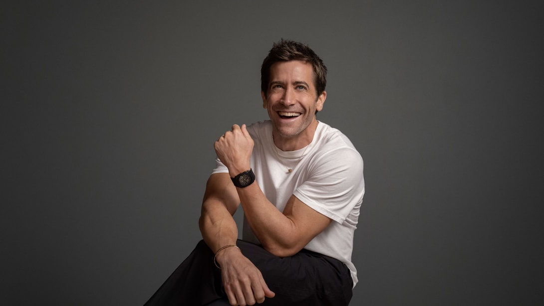 Jake Gyllenhaal wearing Octo Finissimo ultra-thin black titanium watch and B.zero1 necklace.