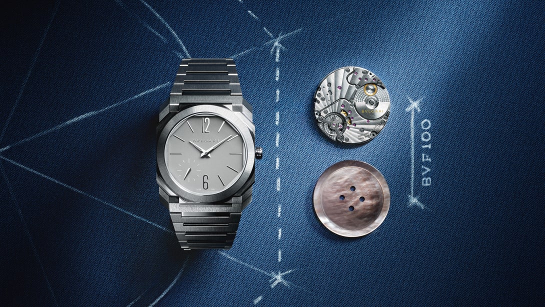 Octo Finissimo Automatic 37 mm watch with movement and button in the same size on blue background.