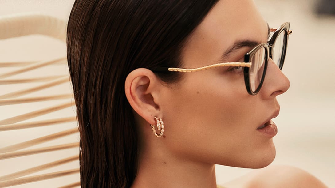Vittoria Ceretti in profile wearing the Serpenti Viper optical glasses with acetate frame, close-up.