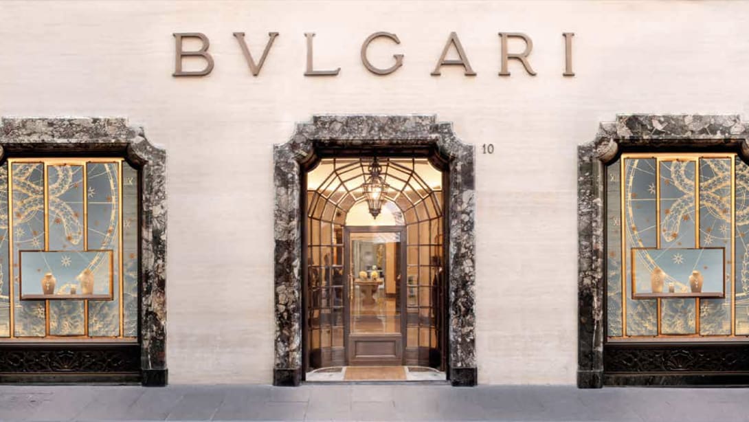 Facade of the Roman Bulgari store in via Condotti with central portal, side windows and Bulgari inscription.