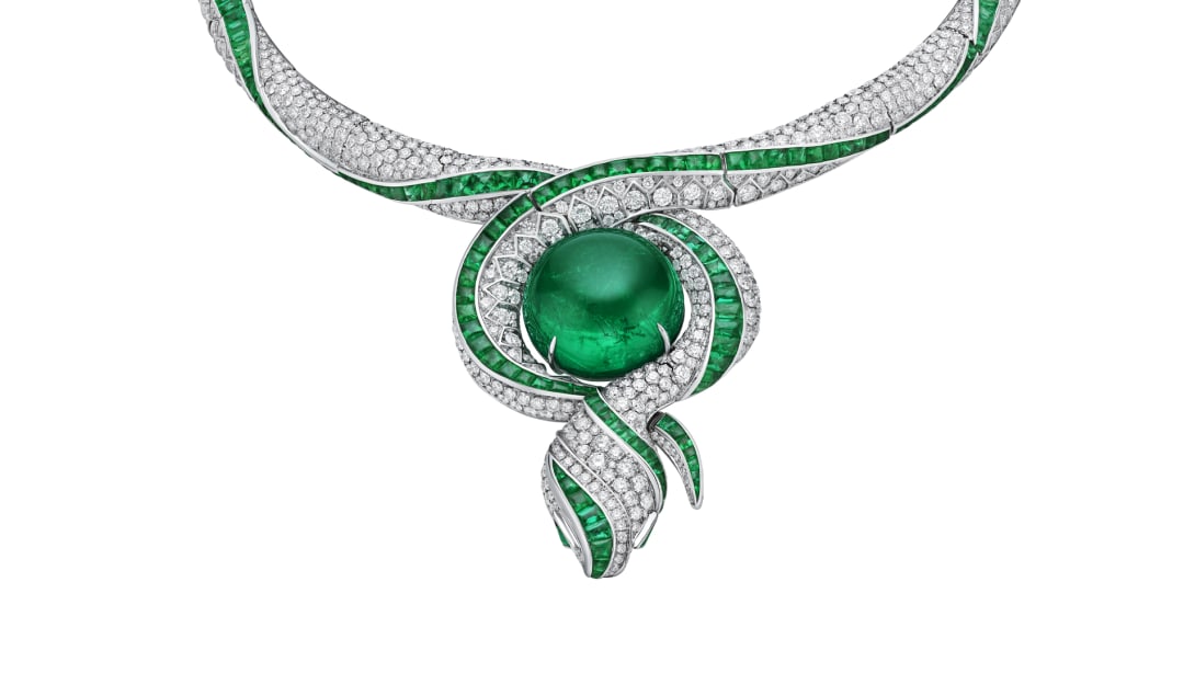 The Terra Mater Serpenti High Jewellery necklace with emeralds and diamonds, close-up.