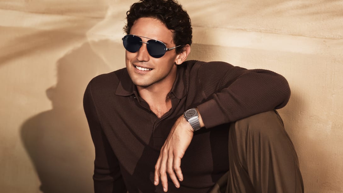 Model wearing Octo Finissimo pilot sunglasses in titanium and an Octo Finissimo watch.