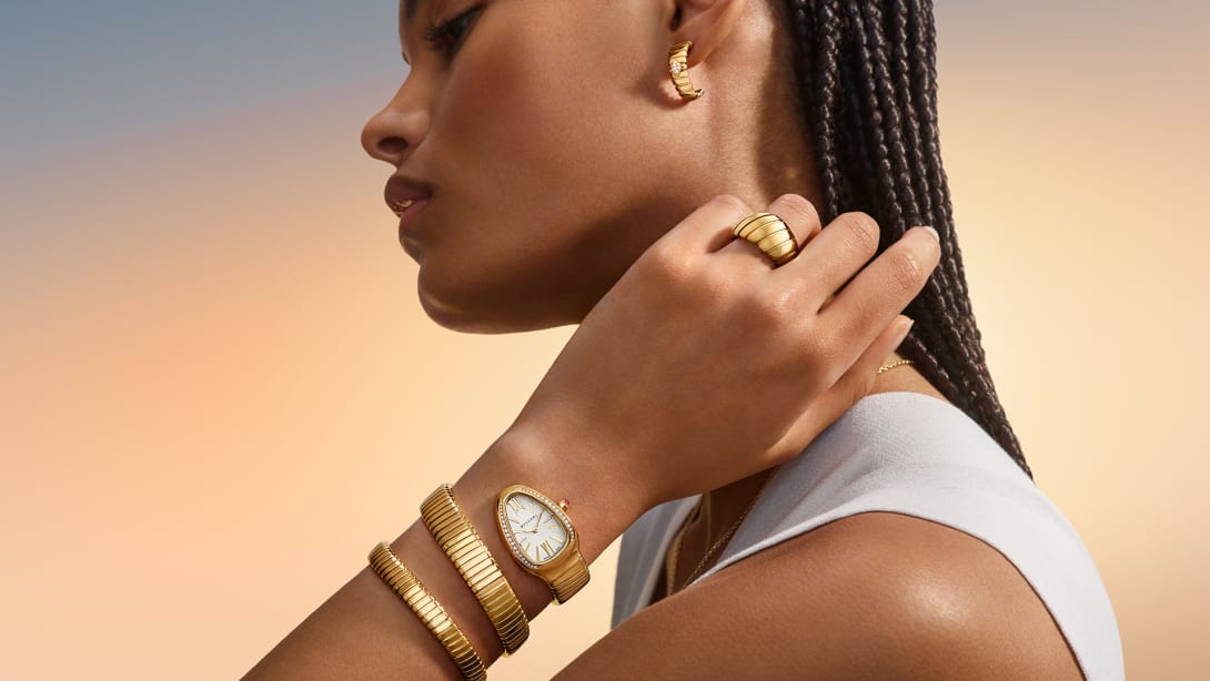 Model wearing Serpenti watch and Tubogas jewellery, Magnificent Icons campaign.