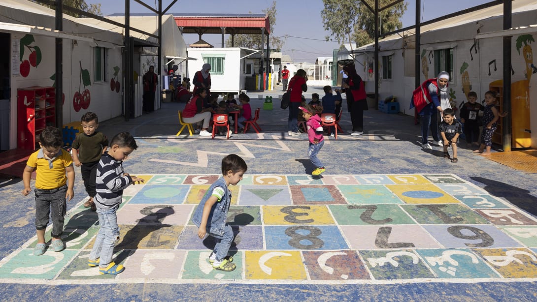 Children playing at one of Save the Children’s educational centres supported by Fondazione Bvlgari.