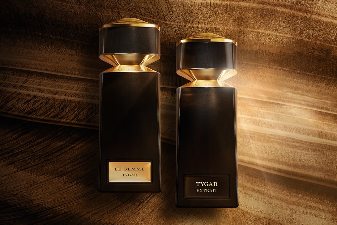 Bvlgari Le Gemme Tygar Extrait and Eau de Parfum flacons with Tiger’s Eye–inspired background.