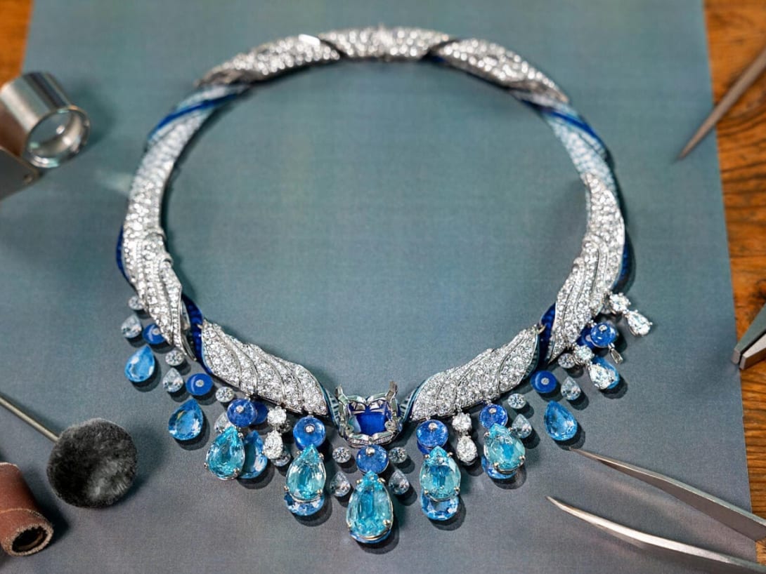 High Jewelry necklace being compared to the original sketch