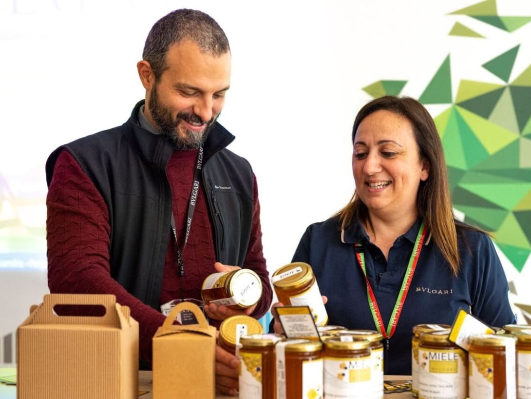 Bulgari employees packing jars of honey
