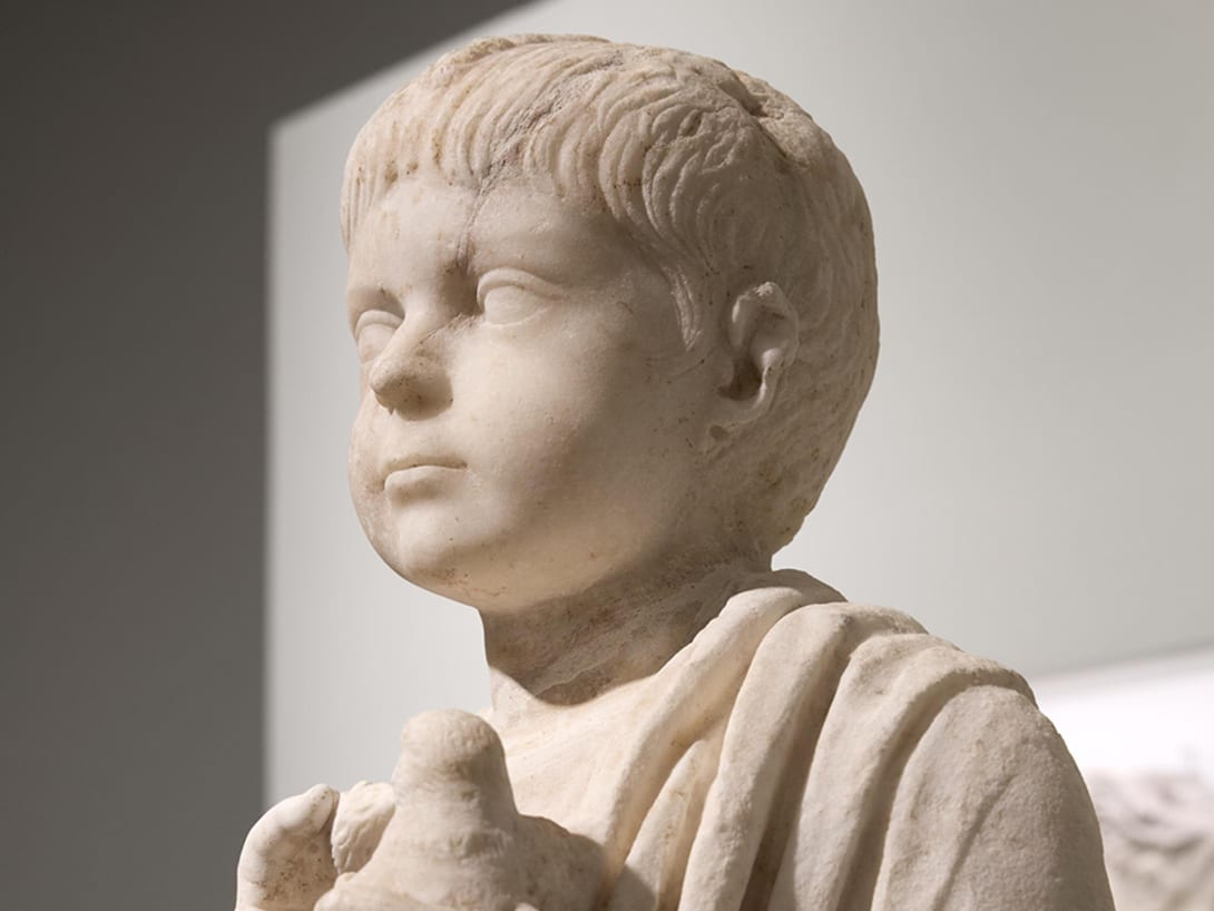 Bust of a young boy, part of the Torlonia Collection, on display at the Myth and Marble exhibition.