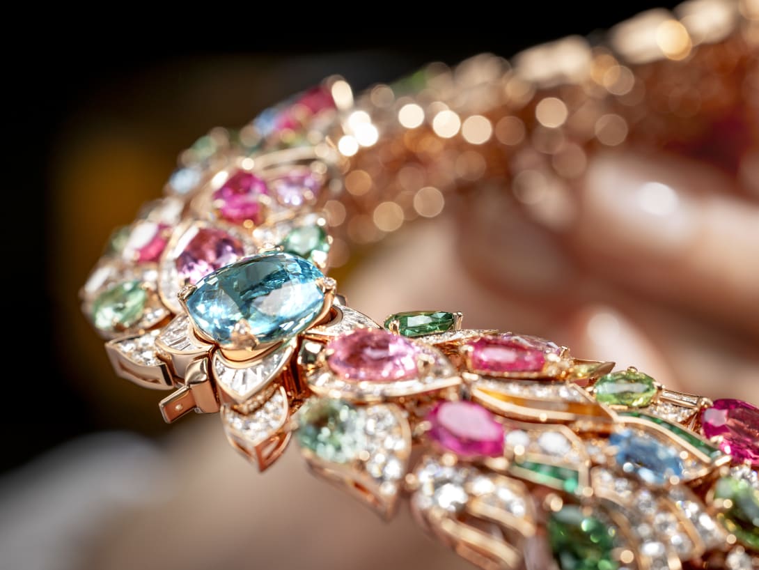 Hand holding Celestial Mosaic Necklace, Polychroma High Jewellery collection.