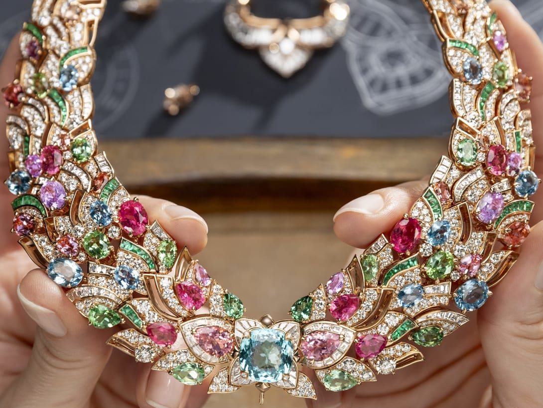 Hand holding Celestial Mosaic Necklace, Polychroma High Jewellery collection.