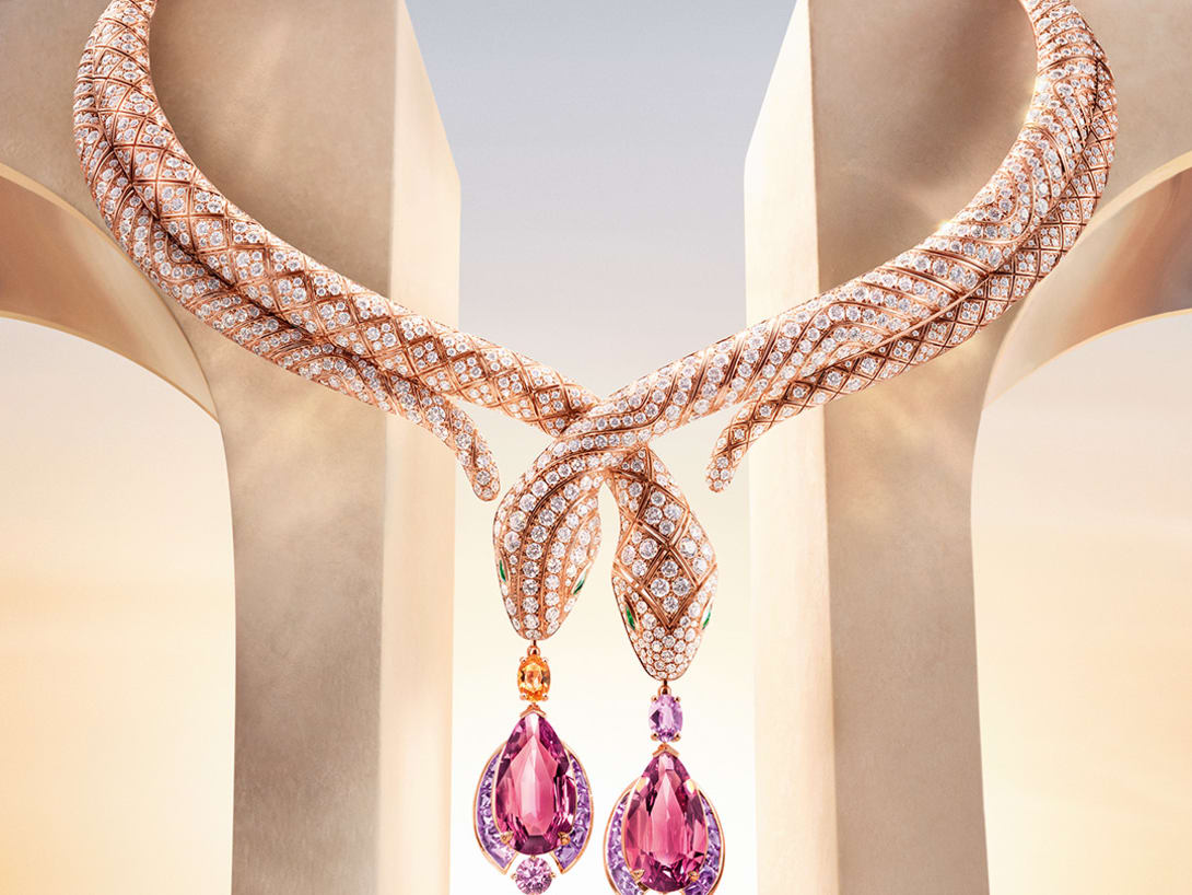 Serpenti High Jewellery necklace set against Roman architectural elements, dawn sky in the background.