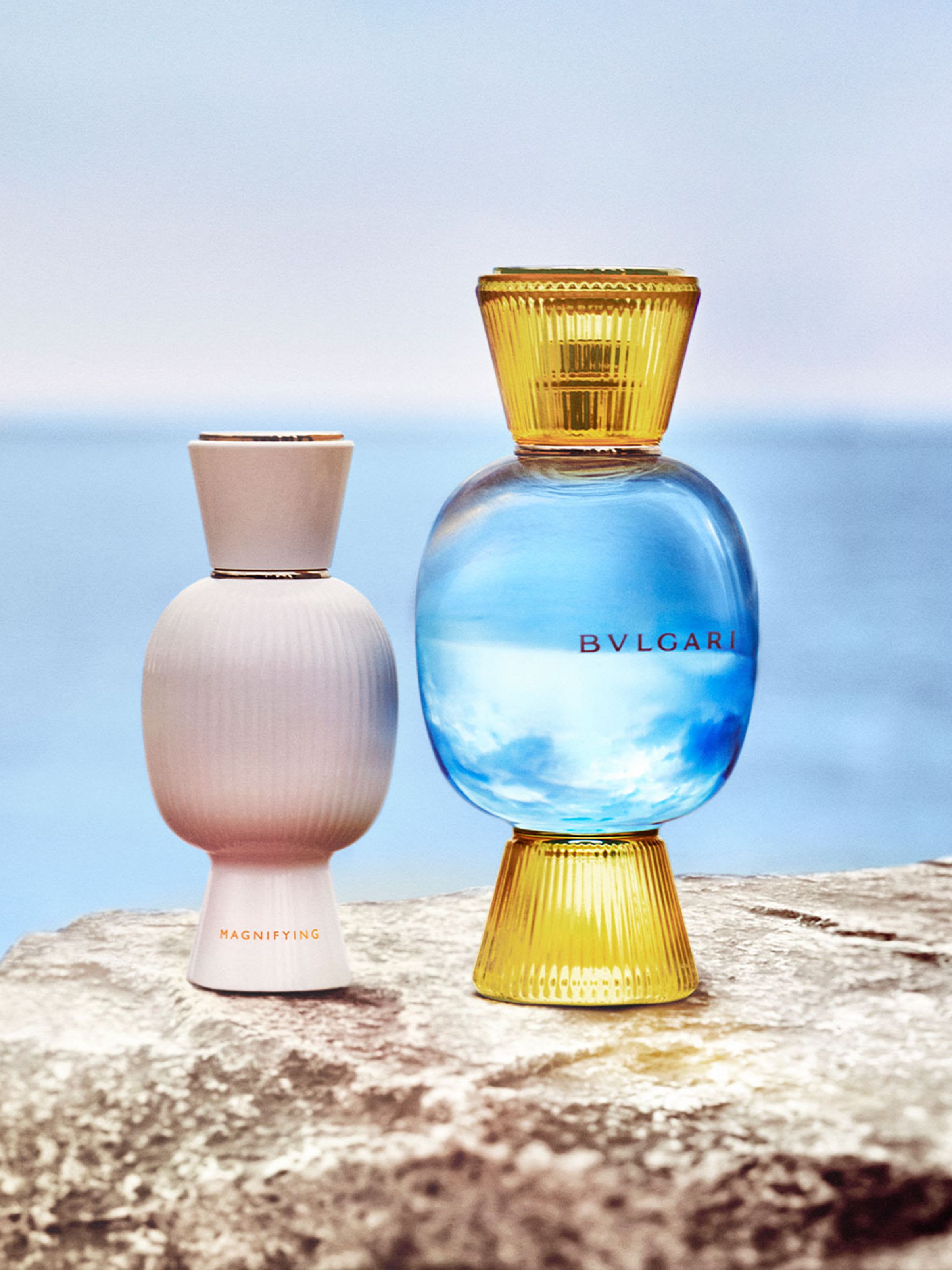 Bvlgari Riva Solare Allegra fragrance bottle in gold and azure glass.