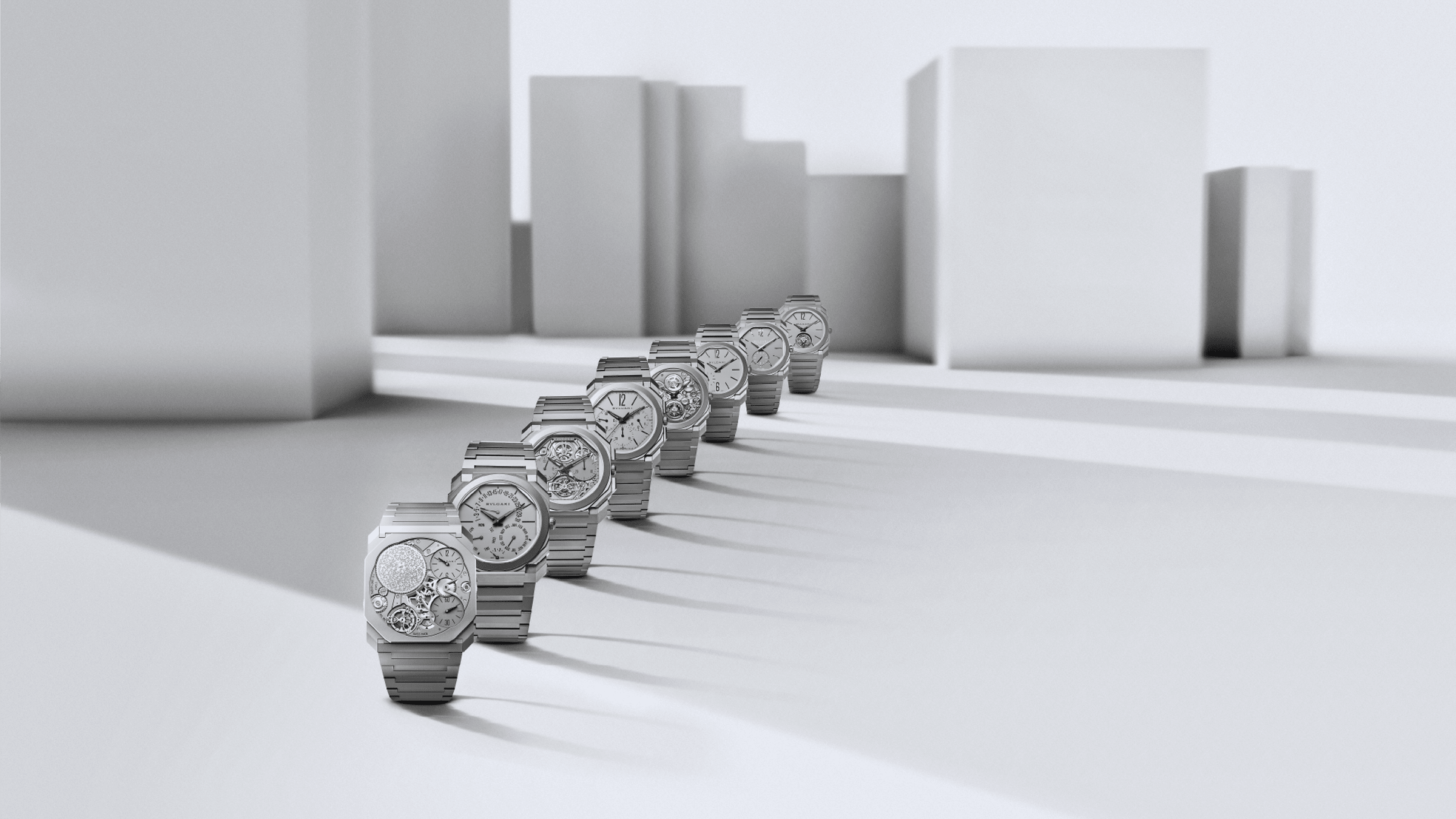 Octo Finissimo world records watches with different calibers and materials, white abstract backdrop.