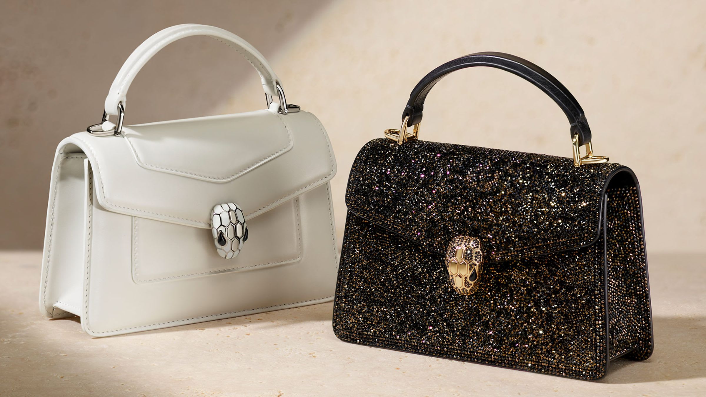 Serpenti bags in white and black calf leather.
