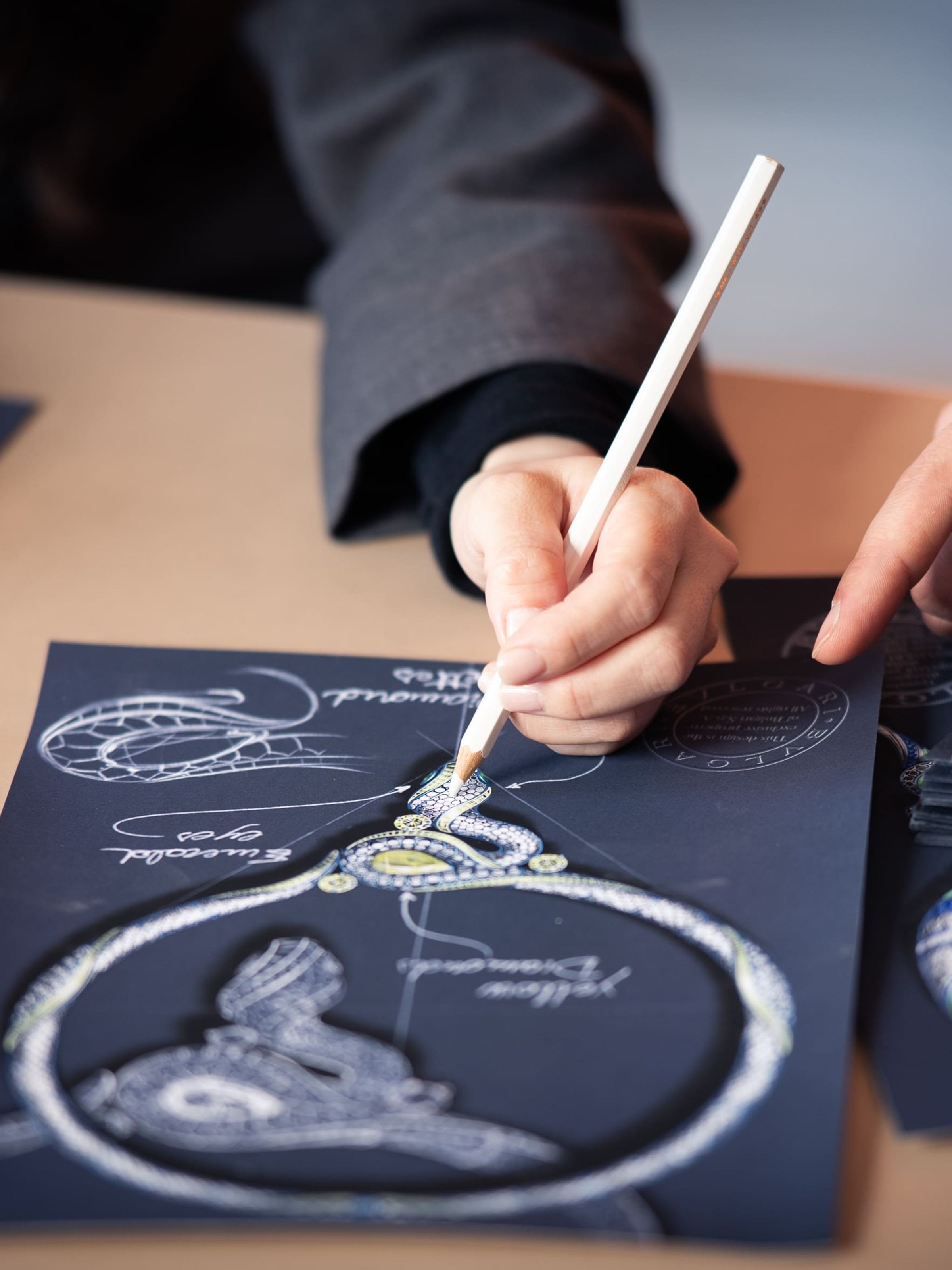 Close up on a designer's hand while drawing