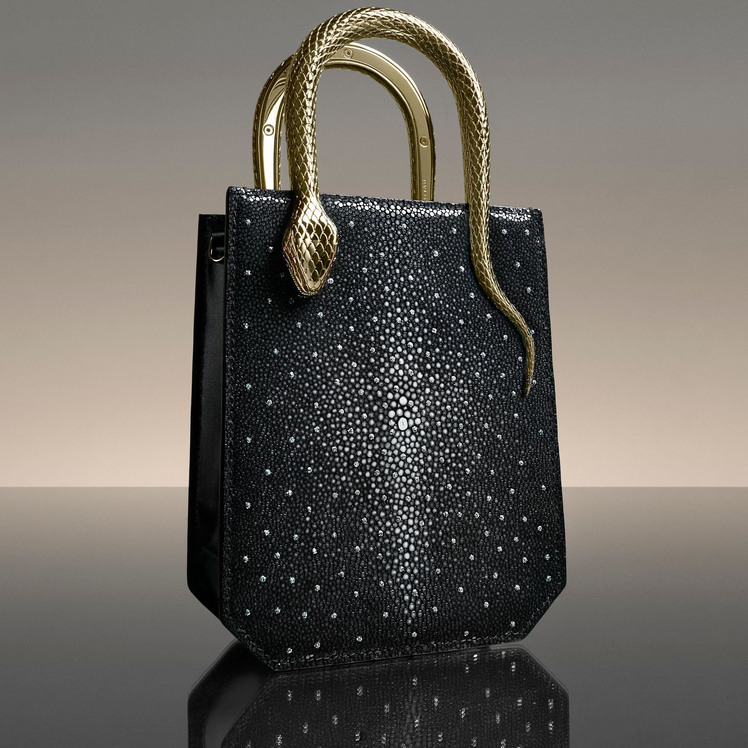 Serpentine Vertical Tote bag in black galuchat skin with diamond dust and metallic snake-shaped handles.