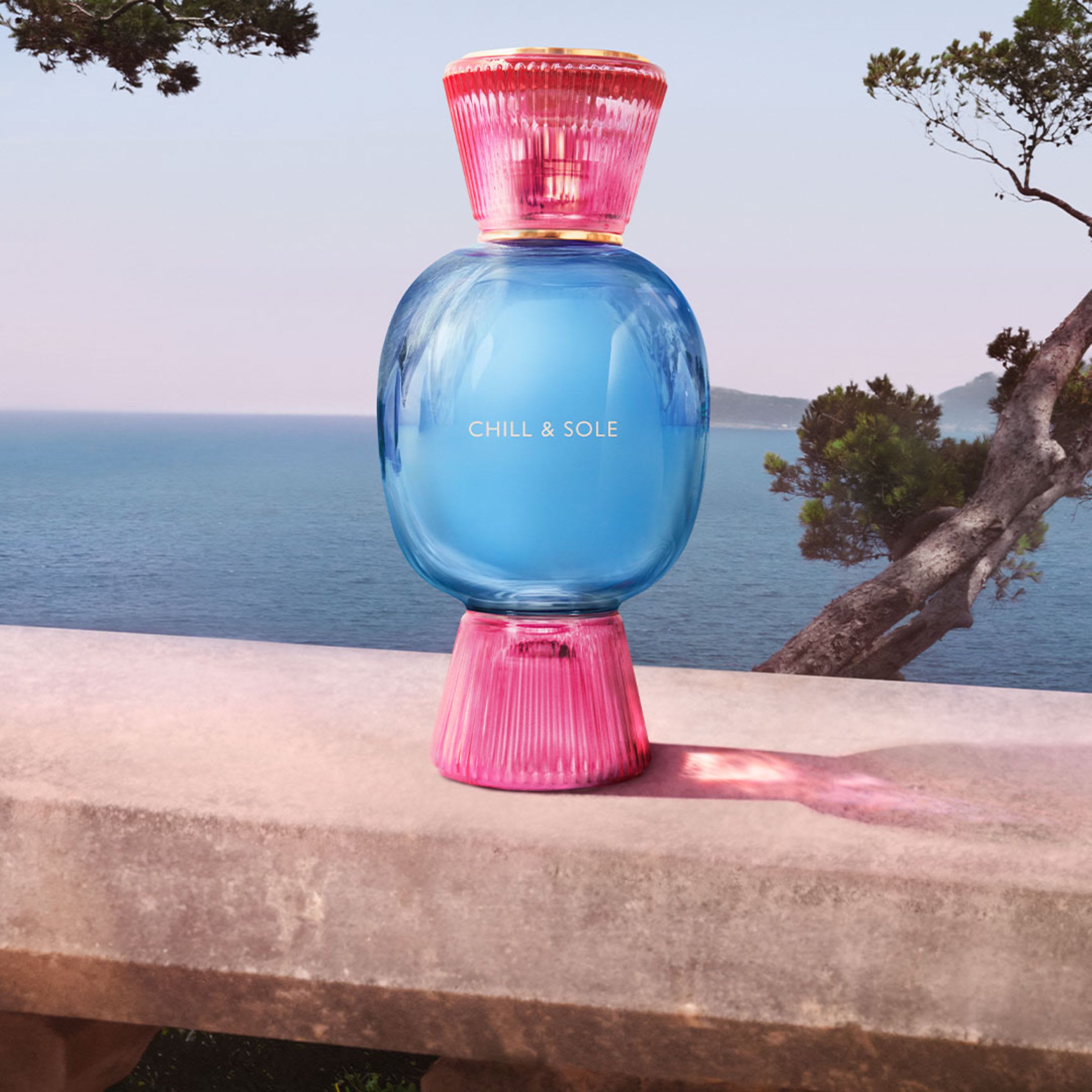 Blue and pink bottle of the Bvlgari Allegra Chill & Sole fragrance and white bottle of the Magnifying Neroli essence.
