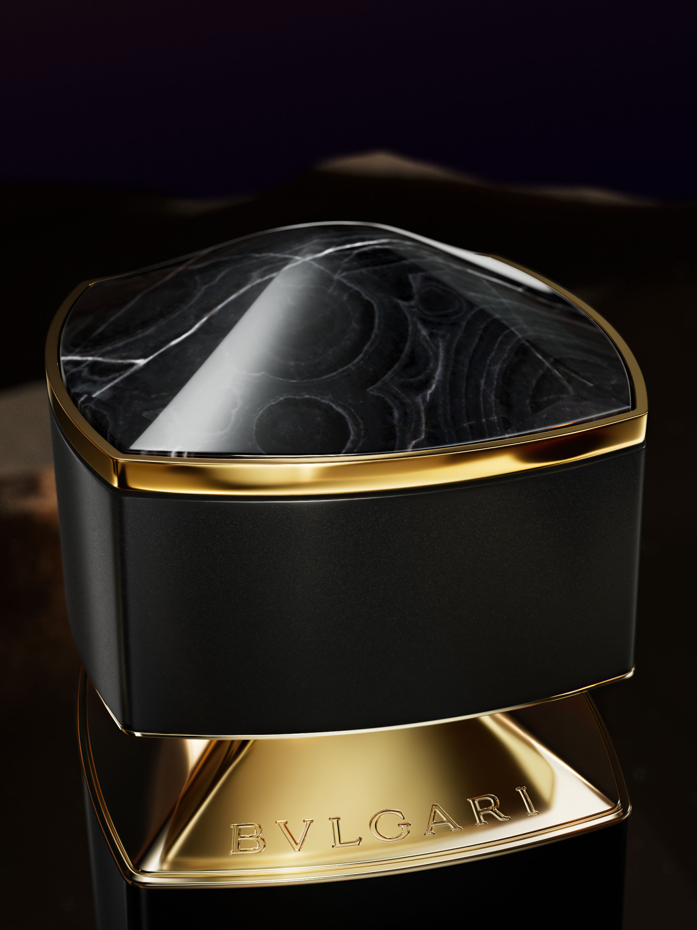 Black cap of the Bvlgari Le Gemme Onekh fragrance inspired by black onyx, close up.