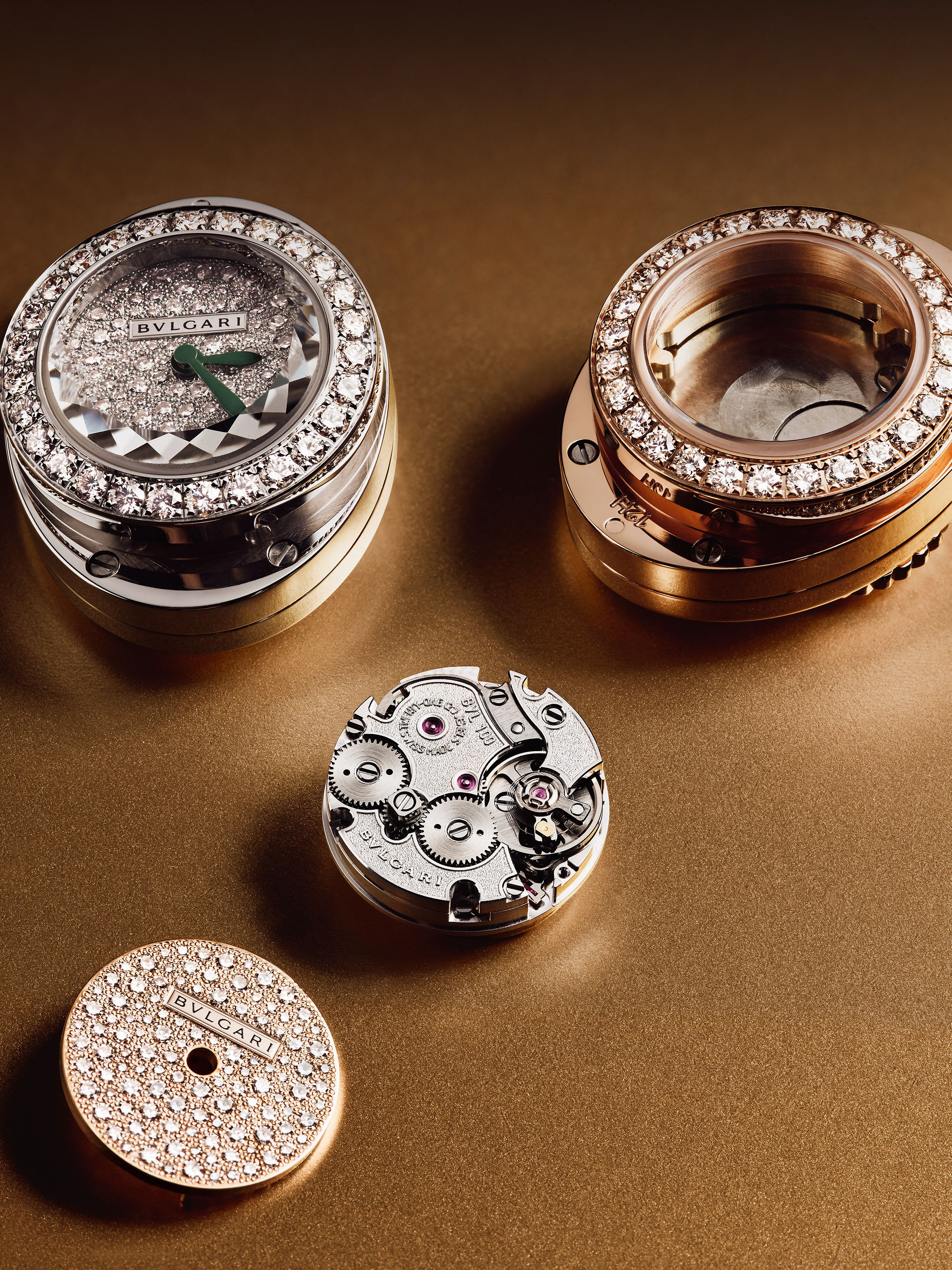 Diamond-set white and rose gold case and calibre of the Serpenti Pallini watch, gold background.