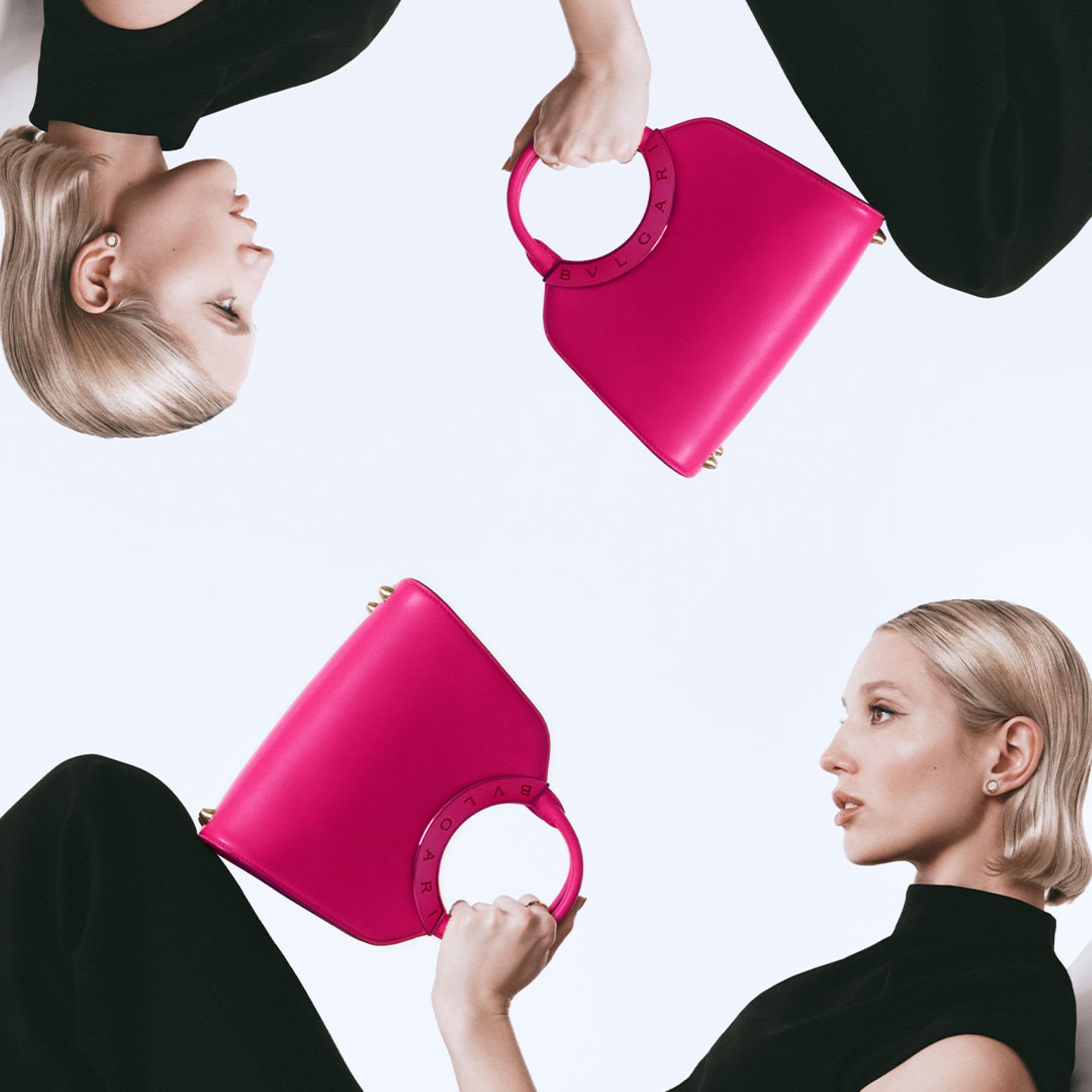 Creative shot of a model holding a Bulgari Roma purple calf leather bag and mirrored image.