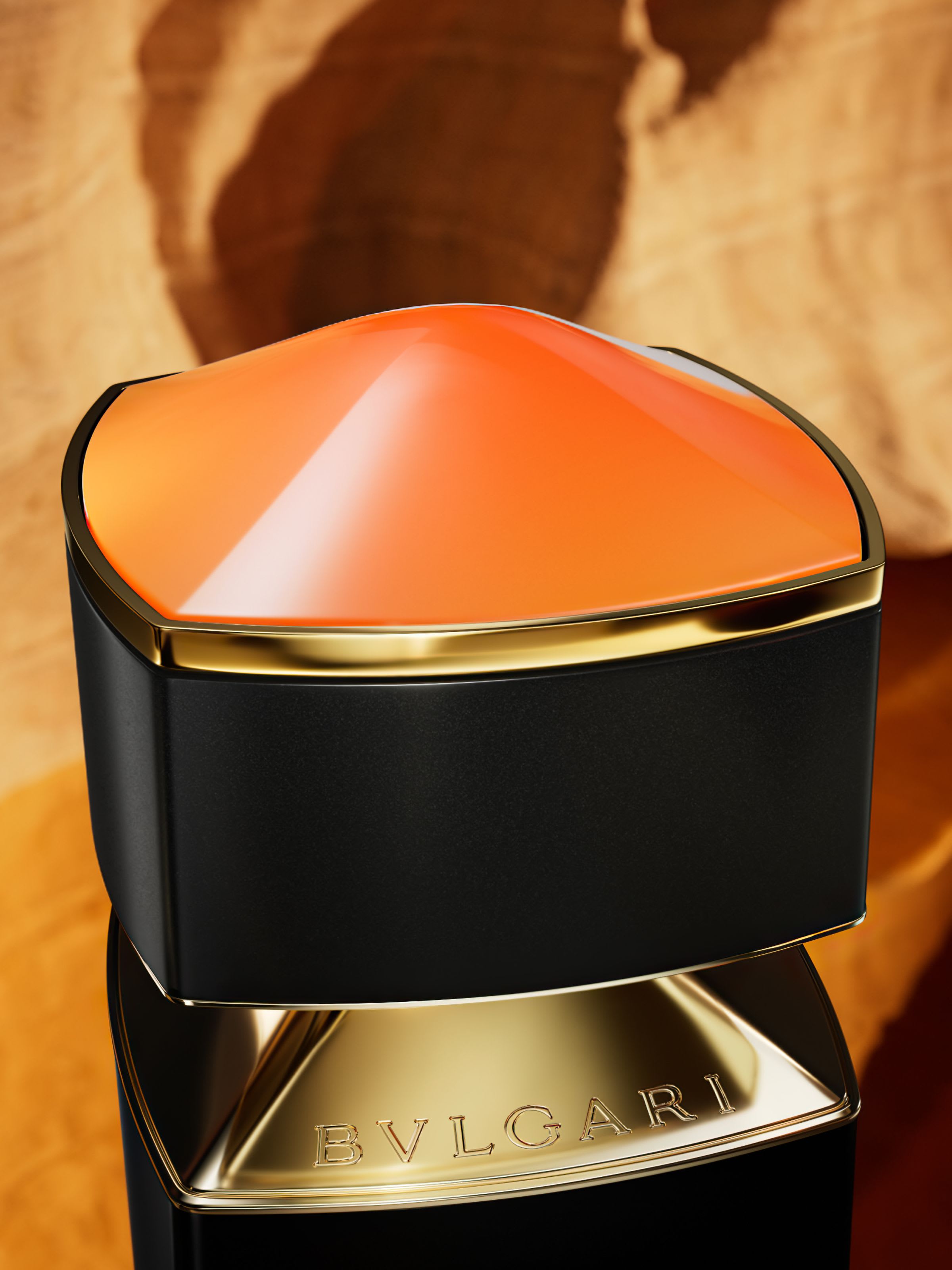 Orange cap of the Bvlgari Le Gemme Ambero fragrance inspired by the amber, close up.
